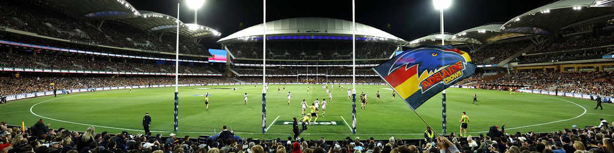 Football game at Adelaide Oval with fans in the stands