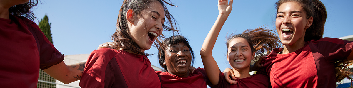 Women celebrating on the sporting field