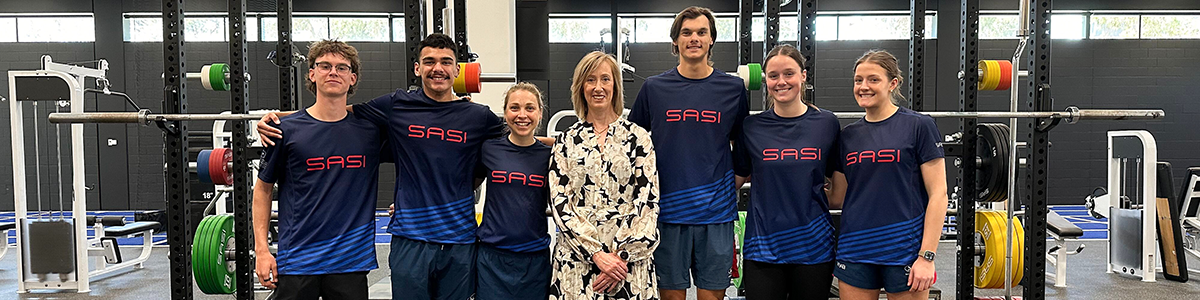 SASI athletes standing with Keren Faulkner