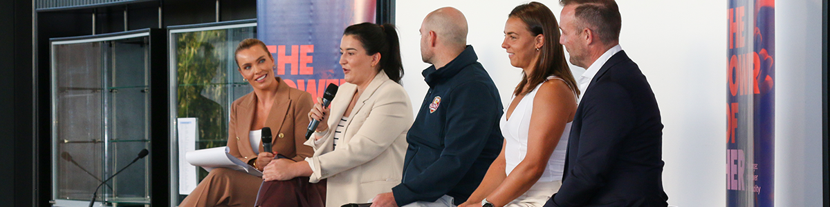 Panel members sitting on a stage