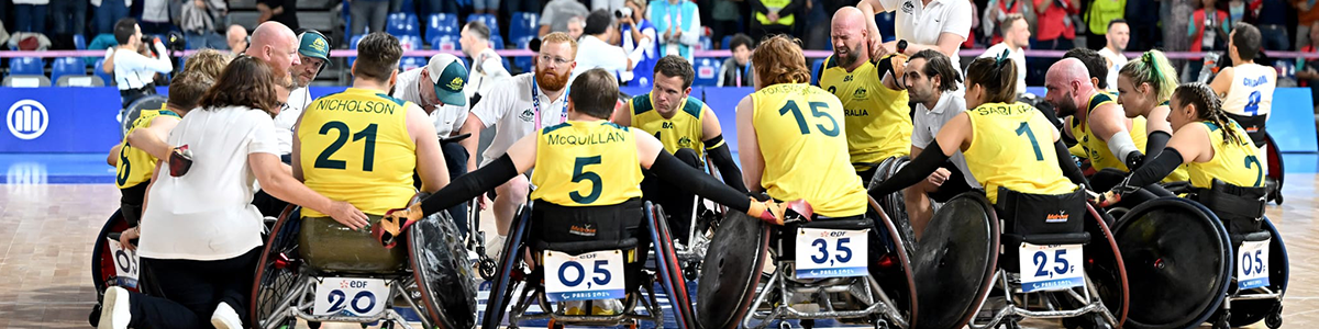 Wheelchair Rugby players in a huddle