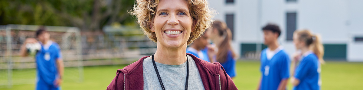 Coach smiling on the field